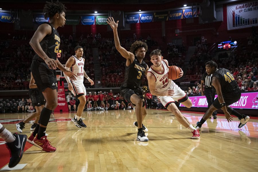 WKU+Hilltoppers%E2%80%99+redshirt+senior+guard+Luke+Frampton+%2814%29+drives+for+a+layup+against+the+ASU+Hornets%E2%80%99+in+Diddle+Arena+on+Tuesday+evening%2C+Nov.+9+of+2021%2C+during+the+Hilltoppers%E2%80%99+first+conference+match+of+the+season%2C+a+nail-biter%2C+which+they+won+79-74.