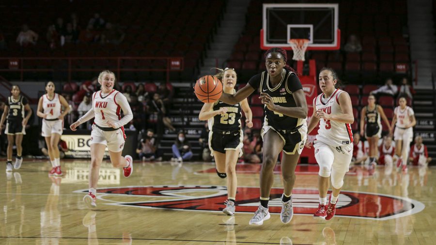 Purdue Boilermakers’ junior guard and forward Mide Oriyome (4) dribbles down court with a turnover from the WKU Lady Hilltoppers in Diddle Arena on Wednesday evening, Nov. 10 of 2021. Western lost the match 79-69.