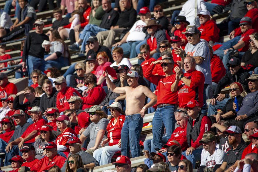 A group of WKU fans cheer on the Hilltoppers during the game against MTSU at Feix Field.