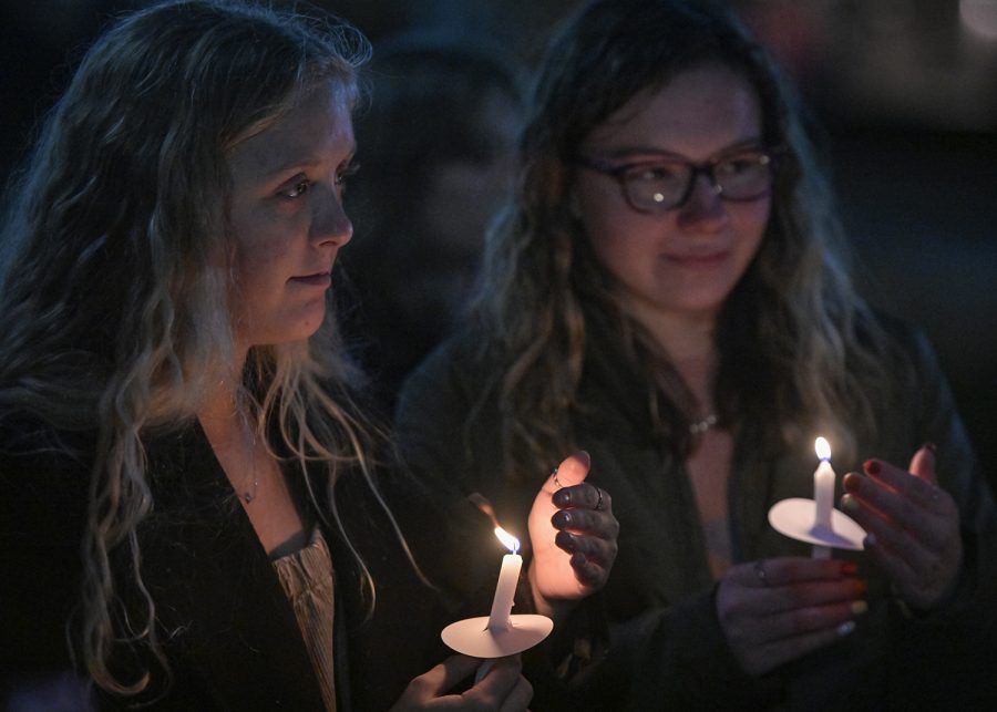 Logan McKnight, an 18-year-old WKU freshman from Dawson Springs, died on Wednesday, Nov. 24 of 2021 following a car accident the previous day. Tuesday.

The following week on Monday evening, Nov. 29, his friends and family held a candlelight vigil by Guthrie Bell tower on campus in his memory. 

Here, Annabel Wilmurth (left) and Makinlee Watters (right) protect their candles from the wind.