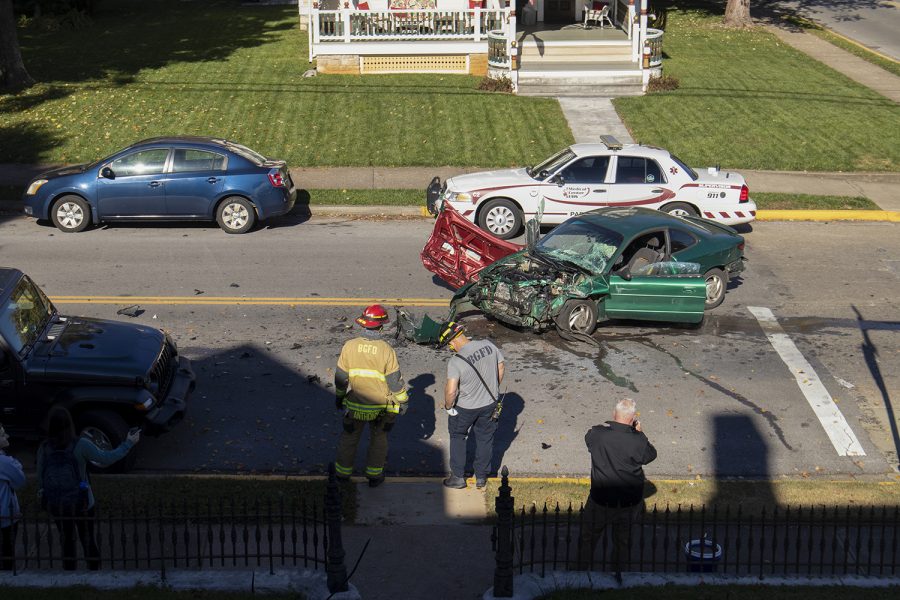 Bowling Green firefighters observe the scene of Tuesday’s accident at East 13th Avenue and State Street where Paul Eden led police on a chase through three Kentucky counties on Nov. 9, 2021.