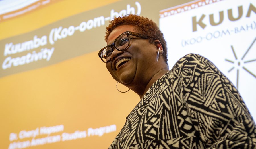 Dr. Cheryl Hopson, an English and African Americans studies instructor, performs a poem she wrote from her book of poems, “Black Notes” during the Kwanzaa celebration on Dec. 2, 2021 in the Downing Student Union.