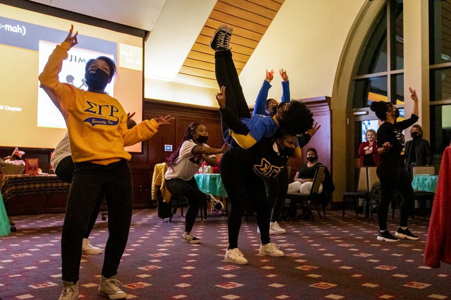 Members of the Sigma Gamma Rho sorority performs a step dance during the Kwanzaa celebration.