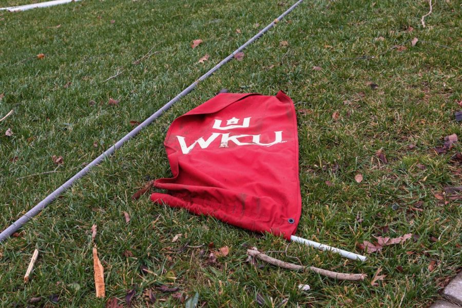 A+WKU+banner+lays+in+the+grass+by+Nashville+Rd.+on+Dec.+11.