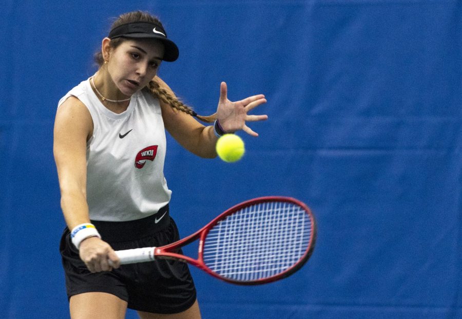 WKU freshman Mariana Zegada readies herself to hit the ball during the tennis match against Lipscomb University at the Michael O. Buchanon tennis facility on Jan. 30, 2022. The Hilltoppers won 4-3, starting off their season off with 2 wins and 0 losses.