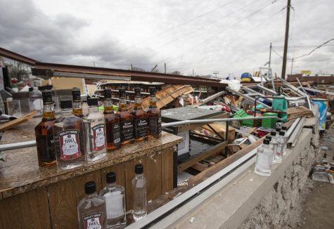 Bottles of Evan Williams bourbon sit within the wreckage of WK Liquors in Bowling Green Dec. 11. In the aftermath of the December tornadoes, the popular store only had one wall that remained standing.