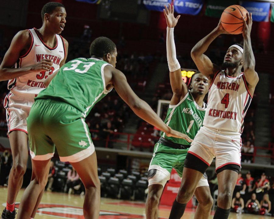 WKU Hilltoppers’ fifth-year guard Josh Anderson (4) plants for a two-point shot against North Texas Mean Green on the afternoon of Saturday, Jan. 15 2022, in Diddle Arena. North Texas won the match 65-60.