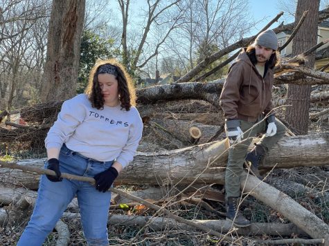 Former Editor-in-Chief Lily Burris (left) and current Editor-in-Chief Michael J. Collins aid in the cleanup of several fallen trees along US 31W Bypass on Dec. 13.
