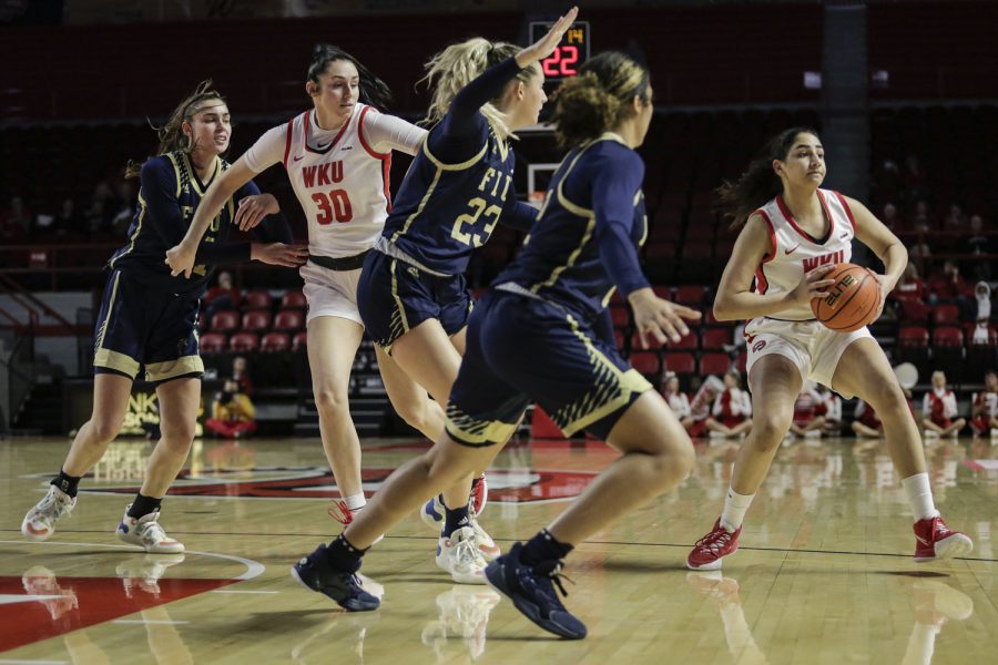 WKU Lady Topper senior guard Meral Abdelgawad (4) passes the ball to her teammate Saturday afternoon, Jan. 22 of 2022 against the FIU Panthers in Diddle Arena. WKU won the match 87-66.