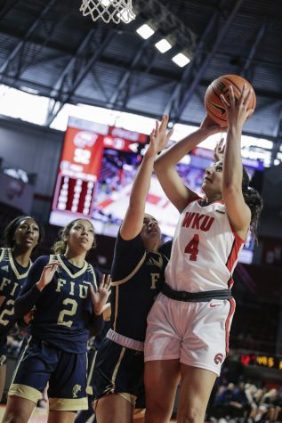 WKU Lady Topper senior guard Meral Abdelgawad (4) shoots for two Saturday afternoon, Jan. 22 of 2022 during a match against the FIU Panthers in Diddle Arena. FIU lost 87-66.