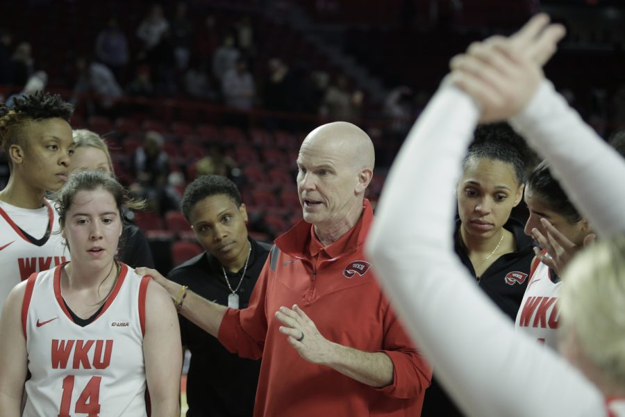Greg Collins, head coach of the WKU Lady Toppers addresses his team on the court after their 87-66 win against the FIU Panthers Saturday afternoon, Jan. 22 of 2022 in Diddle Arena.