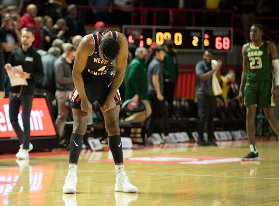 WKU senior Josh Anderson (4) hangs his head inside Diddle Arena after UAB's junior Jordan Walker hits a game winning three-pointer with under five seconds left in the game, giving the Blazers a 68-65 win over the Hilltoppers on Jan. 27, 2022. 