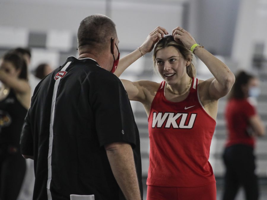 WKU+Hilltoppers%E2%80%99+senior+Katie+Isenbarger+shares+an+excited+moment+with+Brent+Chumbley%2C+head+coach+for+cross-country%2C+track+and+field%2C+after+setting+a+personal+record+for+high-jump+at+the+Lenny+Lyles+Invitational+track+and+field+meet+Saturday%2C+Jan.+28+of+2022+at+the+Norton+Healthcare+Sports+and+Learning+Center+in+Louisville%2C+Kentucky.