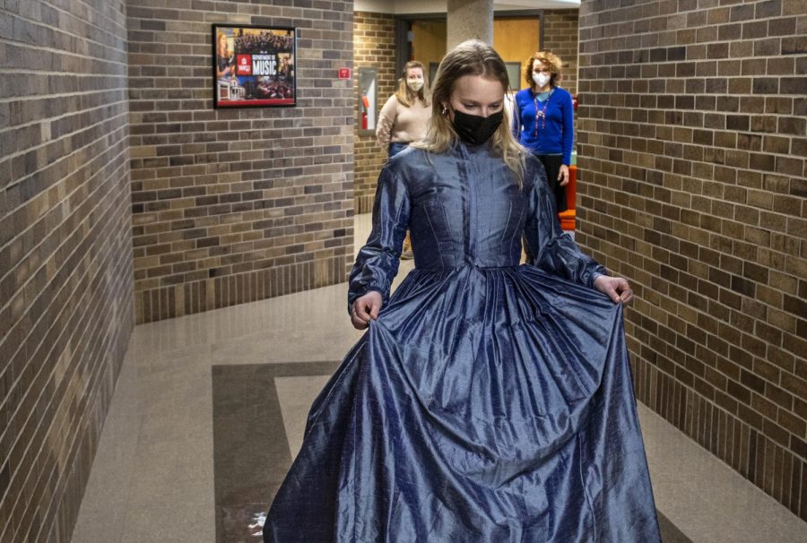 Sarah-Kate Wiseman, a freshman from Louisville, practices walking around the halls of the Ivan Wilson Fine Arts Center in a dress she’ll wear for the WKU theater department’s production of Little Women, in which she’ll play Amy March. She had to practice a gliding motion with her feet in order to not trip over the dress. This will be Wiseman’s first time performing with the theater department.