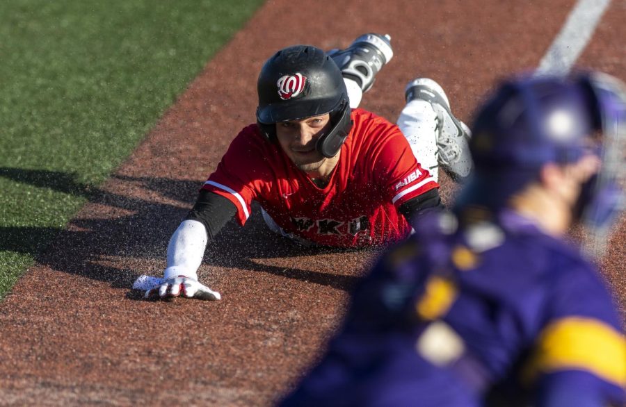 WKU sophomore infielder Eric Riffe attempts to slide into home plate, ultimately getting out before being able to score during the game against Western Illinois University at Nick Denes field on Feb. 20, 2022.