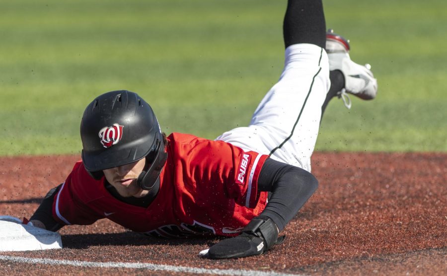 WKU freshman infielder Brett Blomquist slides into first base while attempting to steal second during the game against Western Illinois University at Nick Denes field on Feb. 20, 2022.