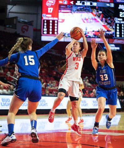 Freshman guard Alexis Mead puts up a two-pointer under heavy pressure from MTSU defenders on Saturday, Feb. 26. WKU won in overtime 93-97.