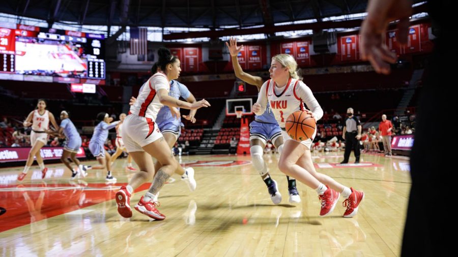 Lady Toppers sophomore guard Hope Sivori (1) , runs around freshman forward Jaylin Foster (11) to get a shot up in during their matchup agaisnt the Old Dominion Lady Monarchs on Feb. 5th in Diddle Arena.