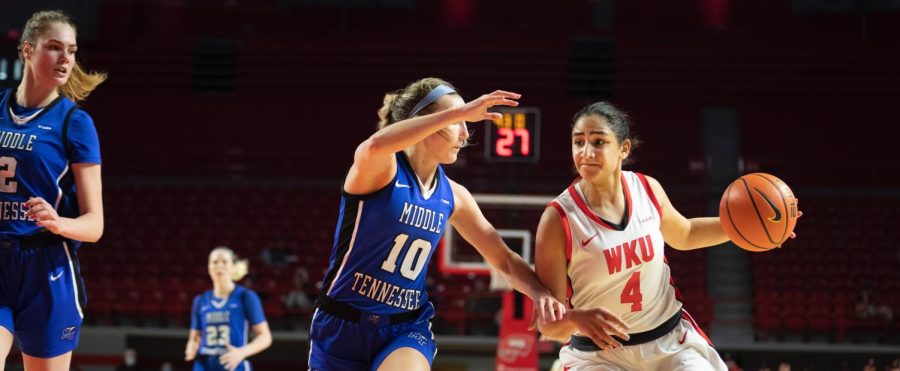 Guard Meral Abdelgawad on a drive under pressure from MTSU defenders on Saturday, Feb. 26. WKU won in overtime 93-97.