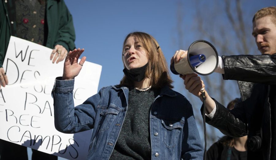 Abi Fitz, co-president of the Feminist Student Union, speaks in front of protestors outside Cherry Hall on Friday, Feb. 18. “Being a woman is exhausting,” Fitz said. 
