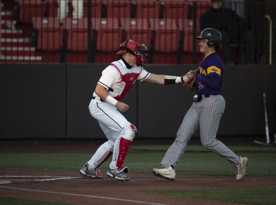 Sophomore Hunter Evans tags a runner for an out on Friday, Feb. 18. WKU won against Western Illinois 6-4.
