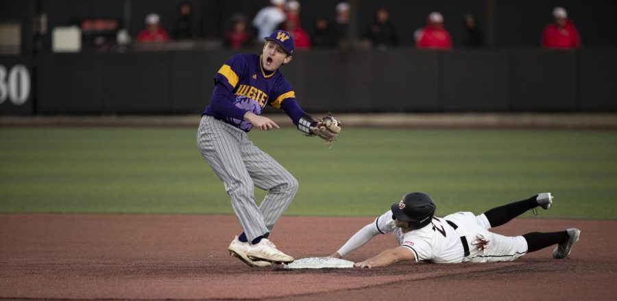 First baseman Aiden Gilroy makes a run for second base and gets tagged out on Friday, Feb. 18. WKU won 6-4.