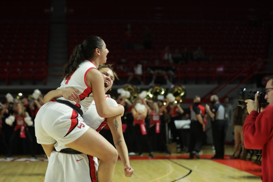 Freshman Gabby McBride and Senior Meral Abdelgawad celebrate their win against MTSU on Saturday, February 26th. WKU won 93-97 after going into overtime.