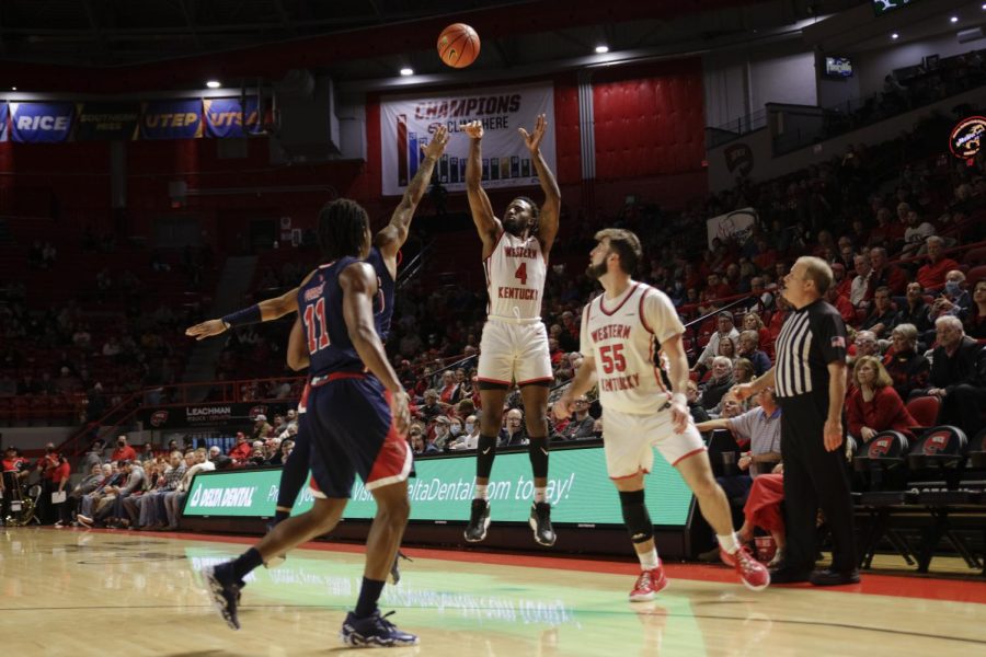 Hilltoppers 5th year guard Josh Anderson (4) puts up a shot from outside the arc to extend the lead against the Florida Atlantic University Owls during their matchup on Feb. 10 in Diddle Arena.
