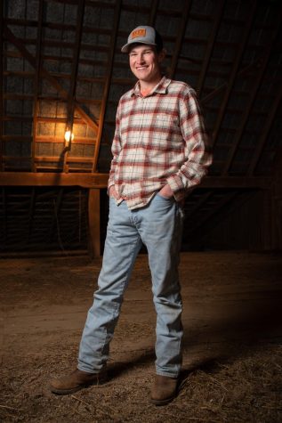 A portrait of WKU junior Alex Burke in the loft of a barn on his family’s farm on Feb. 11, 2022.
