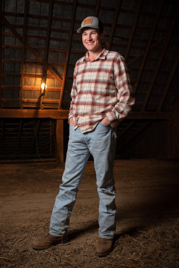 A portrait of WKU junior Alex Burke in the loft of a barn on his family’s farm on Feb. 11, 2022.