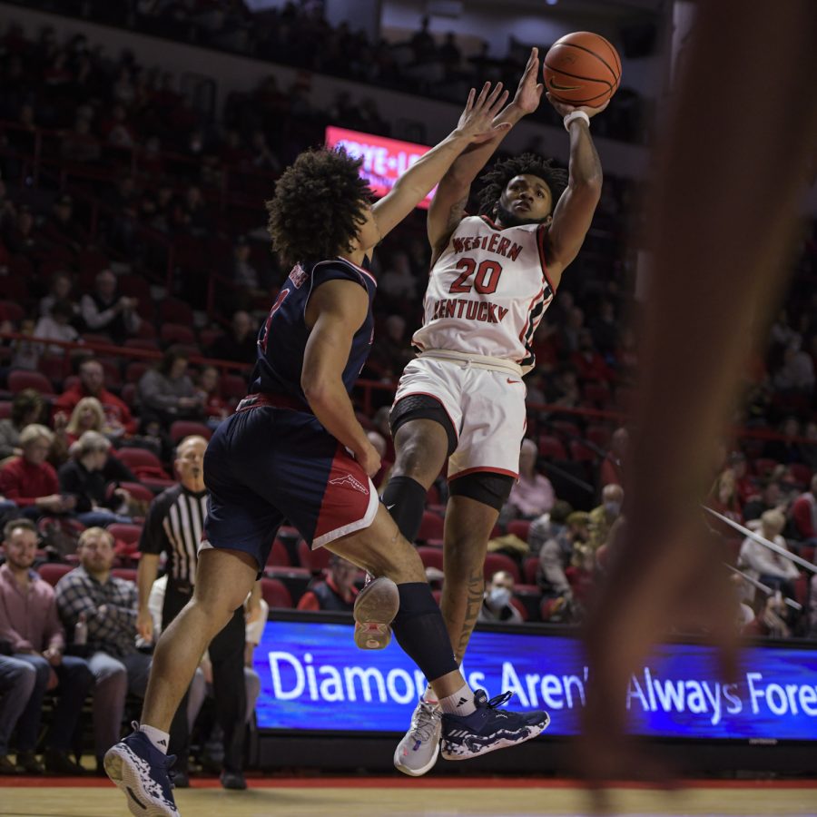 Western Kentucky University Hilltoppers sophomore guard Dayvion McKnight (20) takes a fadeaway shot Feb. 10, 2022, in Diddle Arena, during a match against the Florida Atlantic Owls Thursday evening. WKU won the match 76-69.