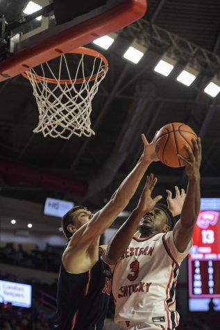 Western Kentucky University Hilltoppers senior forward Jairus Hamilton (3) leaps for a layup against the Florida Atlantic Owls Thursday evening, Feb. 10, 2022, in Diddle Arena. WKU won the match 76-69.