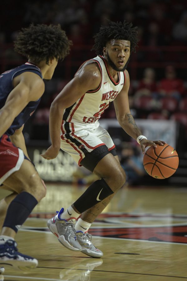 Western+Kentucky+University+Hilltoppers+sophomore+guard+Dayvion+McKnight+%2820%29+looks+for+a+play+against+the+Florida+Atlantic+Owls+Thursday+evening%2C+Feb.+10%2C+2022%2C+in+Diddle+Arena.+WKU+won+the+match+76-69.