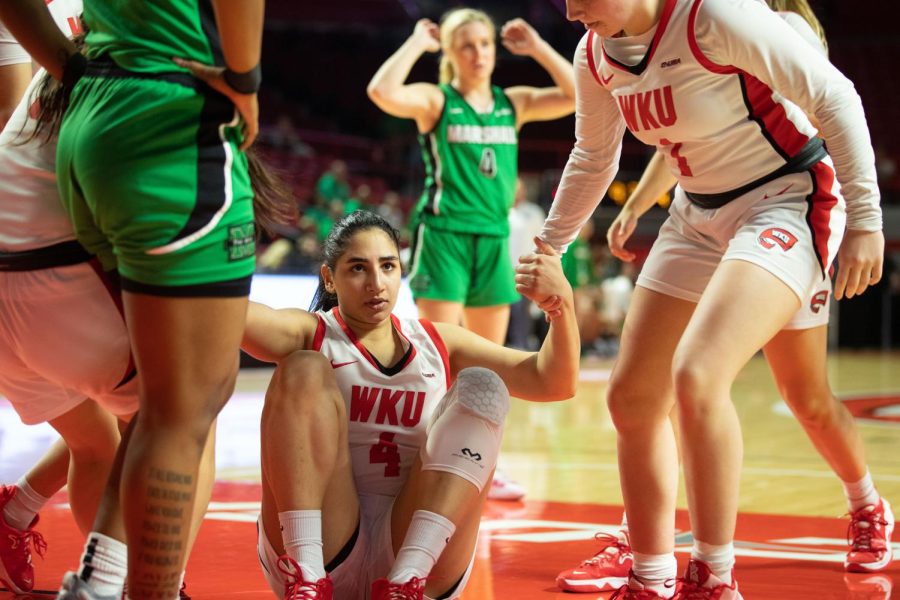 Meral+Abdelgawad%2C+senior+guard%2C+is+helped+up+off+of+the+floor+by+her+teammates+after+being+knocked+down.+WKU+Lady+Topper%E2%80%99s+women%E2%80%99s+basketball+lost+their+game+against+Marshall+80-62+on+Wednesday+night%2C+March+2nd.