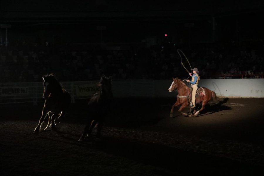 For the opening ceremony of the Lone Star Championship Rodeo on March 26th in Bowling Green, KY, the All-American Cowgirl rides her horse around the arena and lassos other horses.