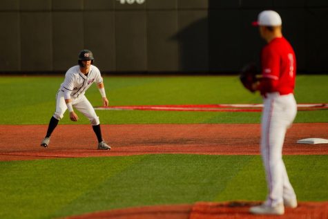 Hilltopper Baseball’s Ty Batusich (9) stares down the Louisville Cardinal’s pitcher as he steps off of second base for an attempt at a steal during their match up with the University of Louisville Cardinals on March 29th at Nick Denes Field.