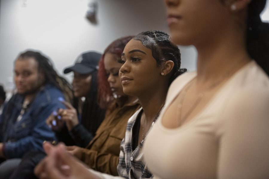Members of the audience react to a poem at the Blaq Art Nouveau and Black Women of Western’s collaborative Night of Poetry event Thursday evening, March 24, 2022 in the ballroom of Mahurin Honors College.