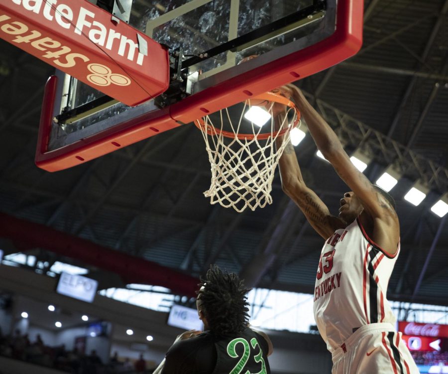Center Jamarion Sharp makes a dunk against Marshall on Saturday, March 5. Sharp made 12 points and 12 rebounds. WKU won 69-78.