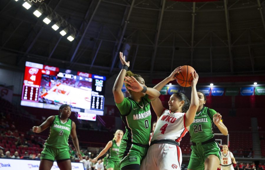 Guard Meral Abdelgawad under heavy Marshall defense in the paint on Wednesday, March 2. WKU lost 80-62.