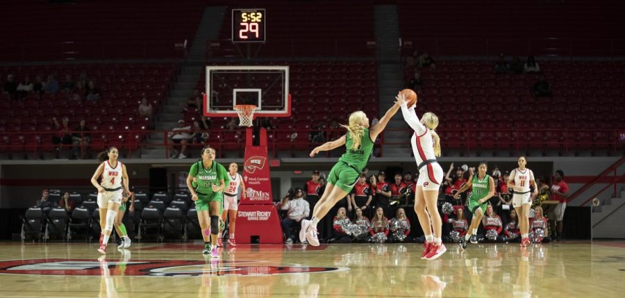 Guard Hope Sivori attempts to gain possession from Marshall on Wednesday, March 2. WKU lost 80-62.