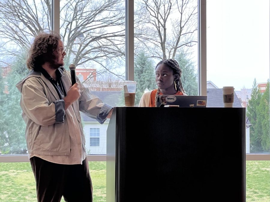 Joseph Eberte (left), and Tani Washington (right), hosts of the podcast Diasporic, speak to students about personal identification in the Mahurin Honors College on March 31, 2022.