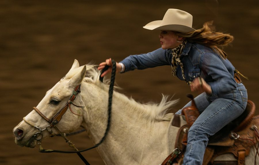 A cowgirl competes in barrel racing Friday evening, March 25, 2022 at Western Kentucky University’s L.D. Brown Ag Expo Center for the 40th Annual Lone Star Rodeo.