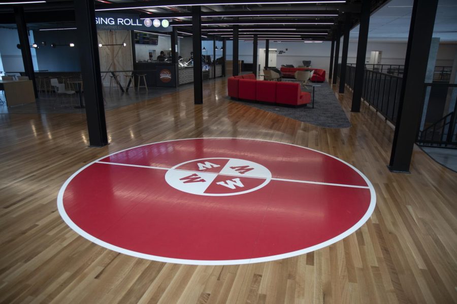 The jump circle, a nod to the buildings past as the home of the Hilltoppers basketball team, is prominently displayed in the lobby floor.