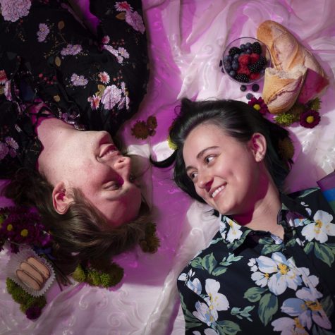Rome Doddema (left) and Sumeja Hrnjic (right) take part in a picnic photoshoot on April 21, 2022. Rome is a transgender woman and Sumeja is non-binary.