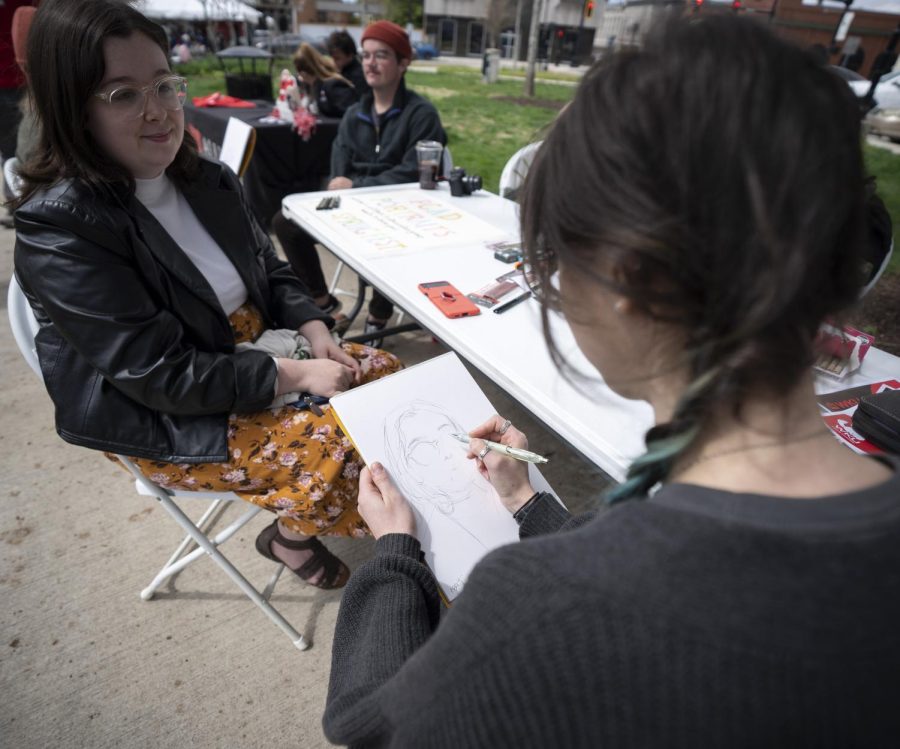 A student from the PCAL art & design draws a portrait in Fountain Square Park as part of the PCAL Spring Forward Festival on Saturday, April 9. 