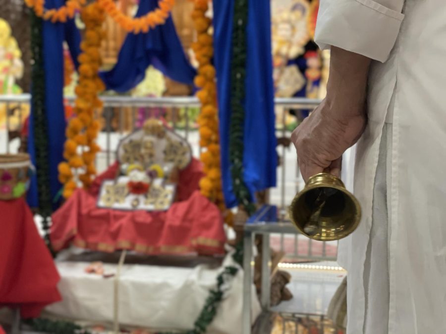 Nick Patel rings a bell and makes final offerings for the night, bringing Ramanavami to a close on March 3, 2023.