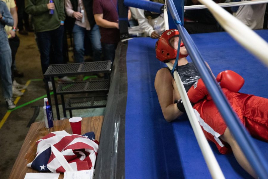 Jacob Morrison, a member of Pi Kappa Alpha, gets knocked down by John Kutz, a member of Alpha Tau Omega, during their boxing match at Sigma Chi’s Fight Night on Friday, April 8th.
