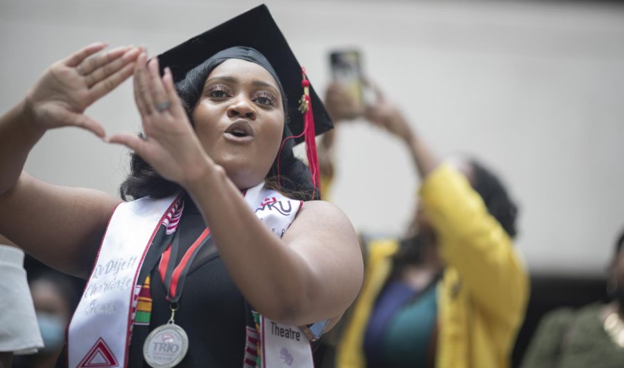 A Delta Sigma Theta sorority member performs a sing and dance with their sisters after their graduation ceremony on Friday, May 6.
