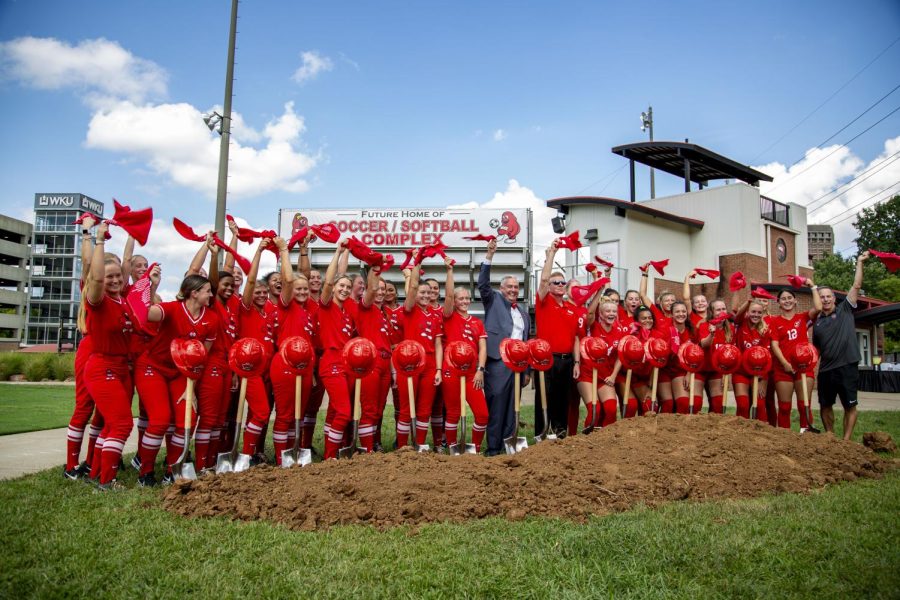 Members of both WKUs soccer and softball teams celebrate during the ground breaking event for the programs sports complex on Aug. 30, 2022.