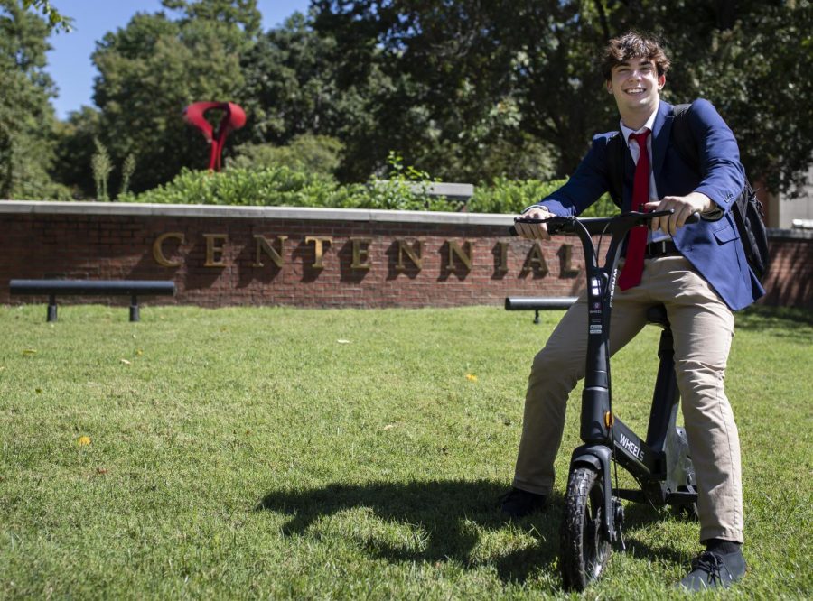 Jaxon Straub, a freshman in finance at WKU sits on a Wheels scooter during a Q&A at Centennial Mall on WKU Campus in Bowling Green, Ky. on Monday, Sept. 12, 2022. 